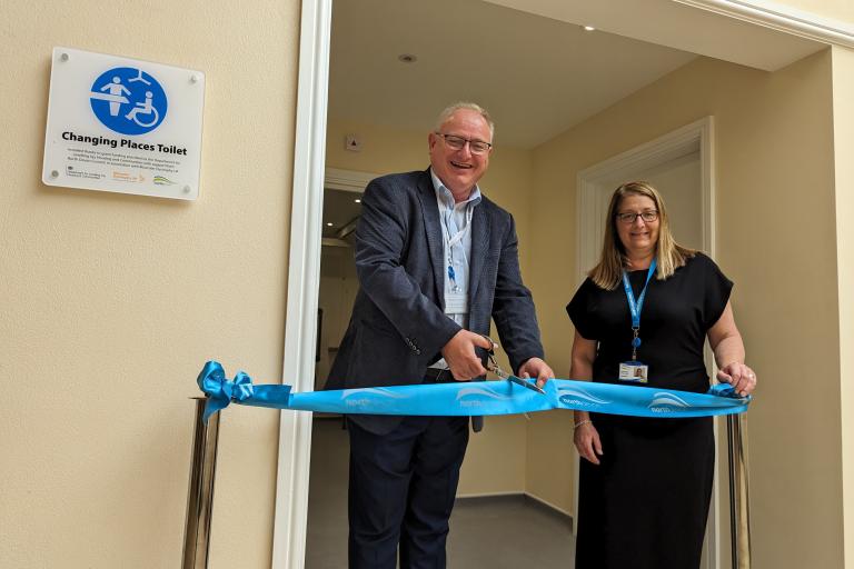 North Devon Council leader, Councillor Ian Roome, and North Devon Council property manager Helen Bond cut the ribbon for the new Changing Places toilet in Green Lanes Shopping Centre