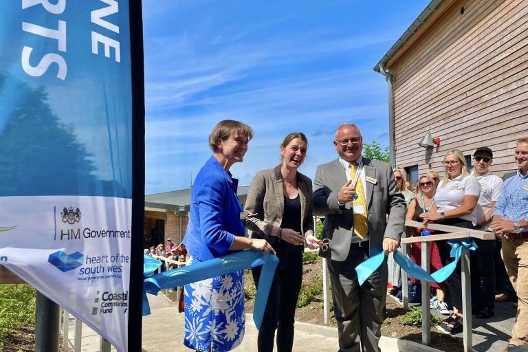 North Devon MP Selaine Saxby,  Parliamentary Under Secretary of State for Levelling Up, Dehenna Davison MP, and leader of North Devon Council, Councillor Ian Roome, cut the ribbon to open the Ilfracombe Watersports Hub