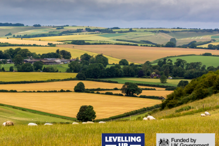Picture of the countryside hills with the levelling up fund logo