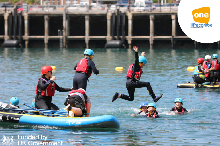 Children jumping into water