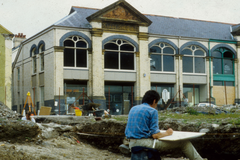 Person in archaeological dig site