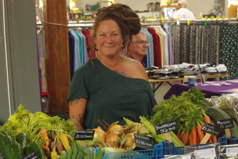 Woman in front of Amary Farm Stand