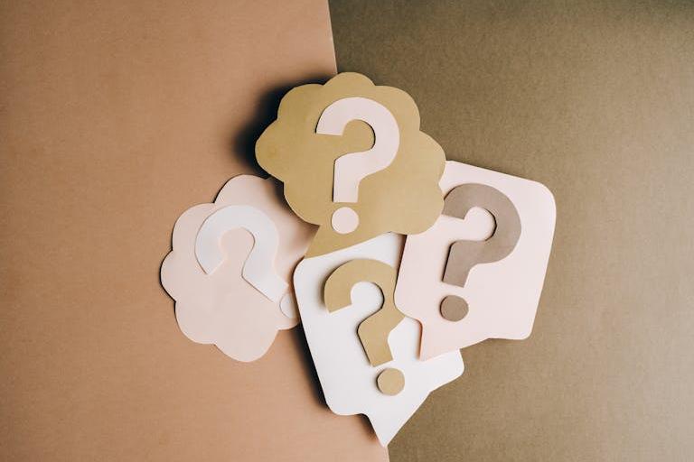 Question marks on a brown background